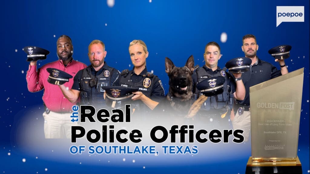 A group of five police officers and a police dog are holding a trophy. They stand against a blue background with the text "The Real Police Officers of Southlake, Texas." Blue and white particles float around them.